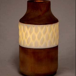 Vase with wooden top and white middle section on a white background